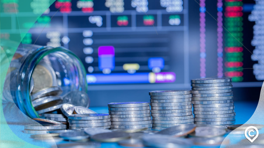 dinheiro e gráfico representando investimento no mercao fracionário